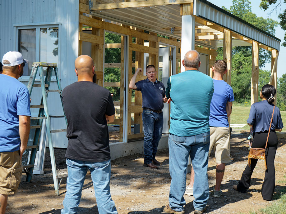 Post-frame training eave construction