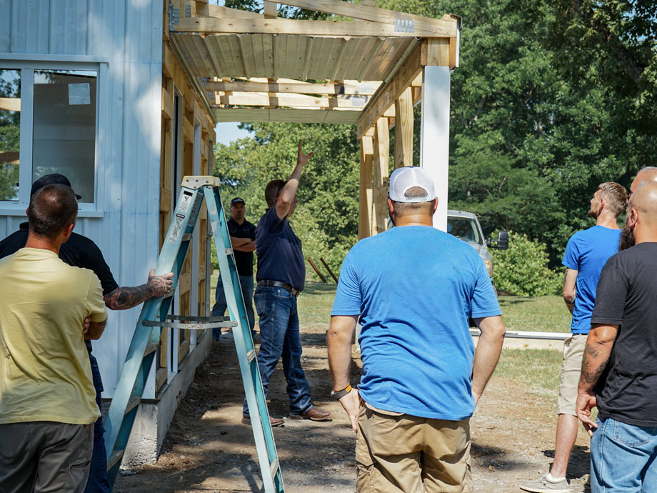 Post-frame training header installation